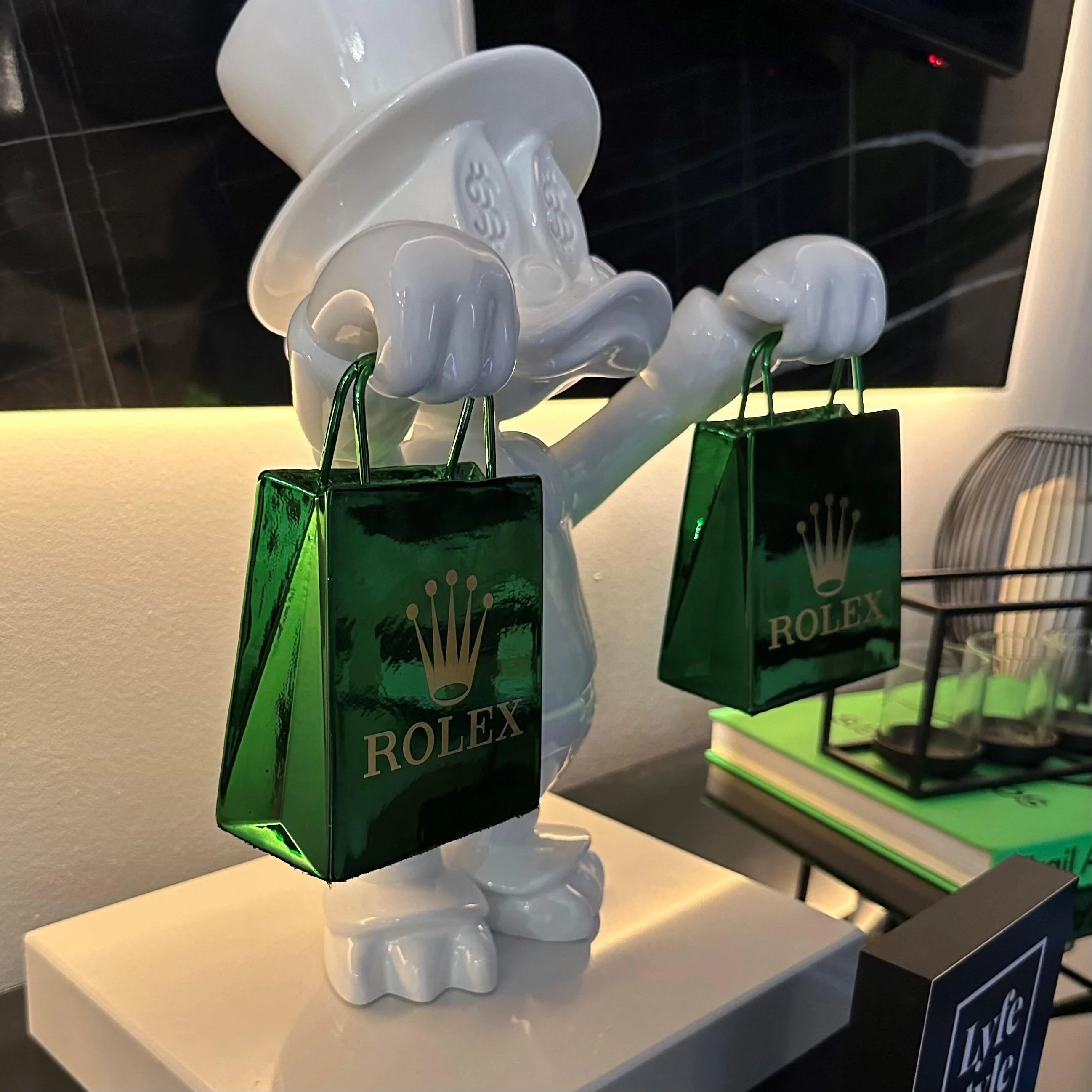 A single green leaf against a white background.