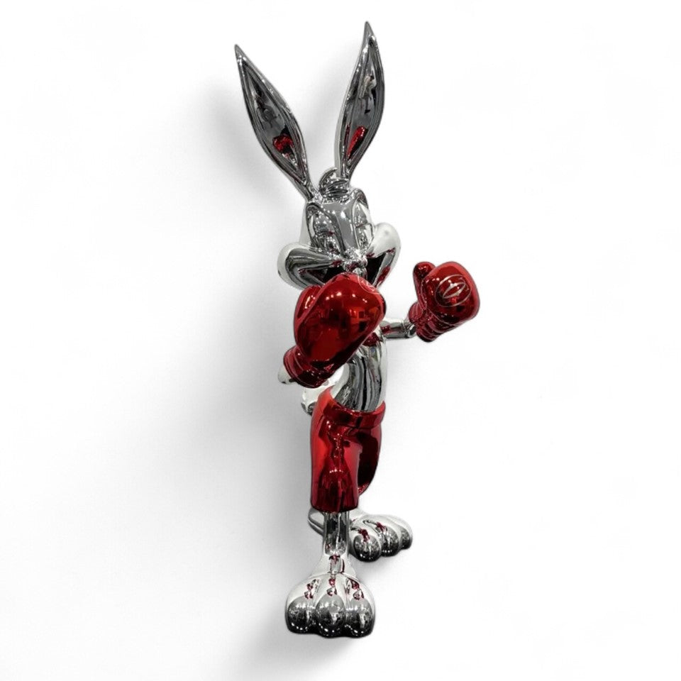 A single green leaf against a white background.