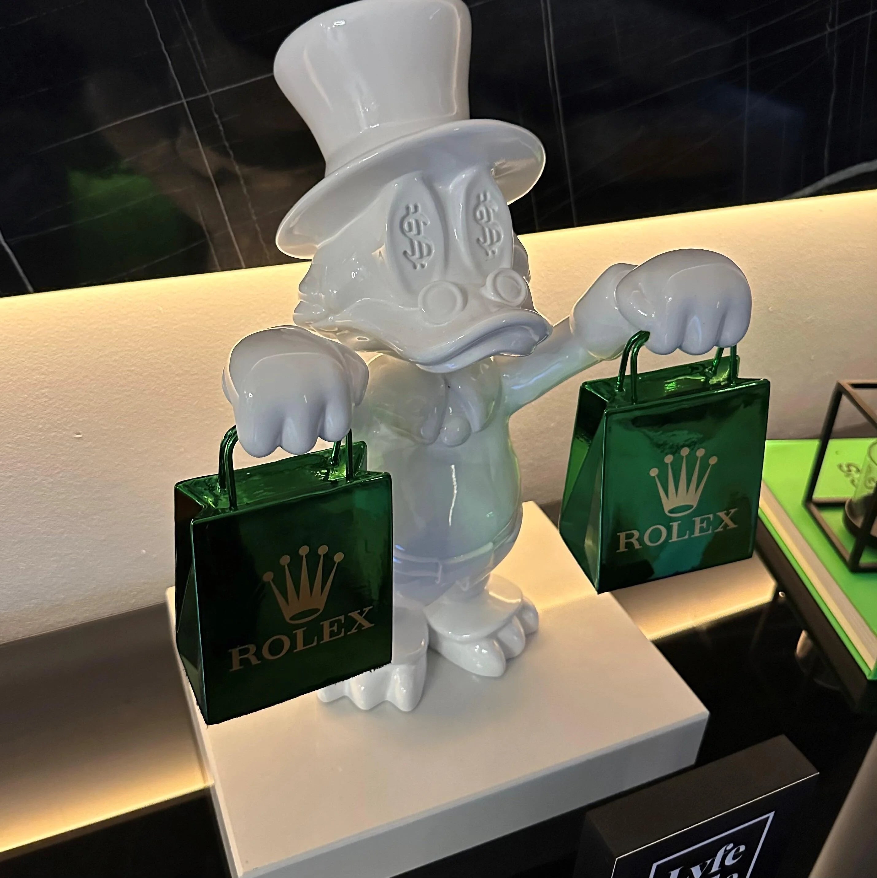 A single green leaf against a white background.