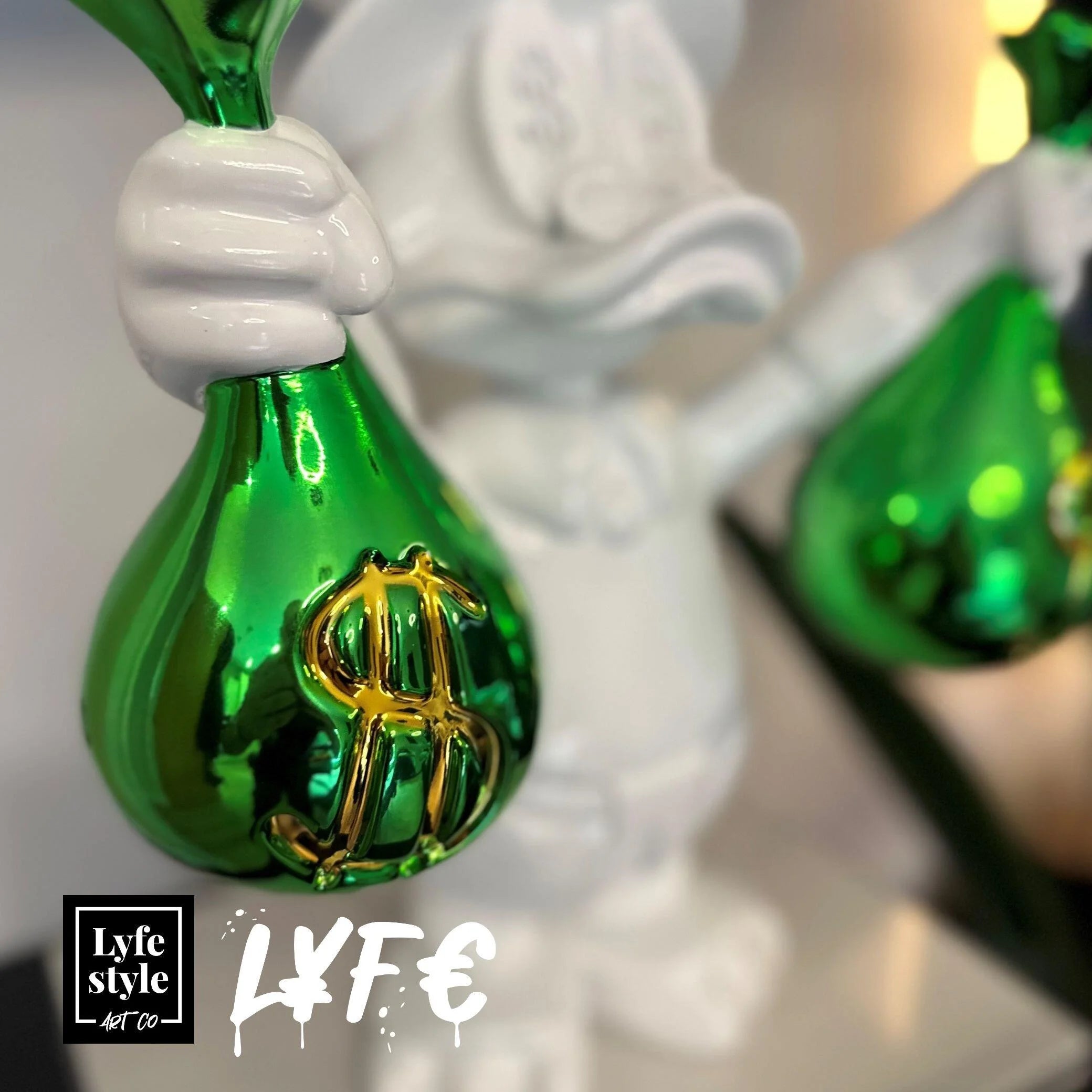 A single green leaf against a white background.